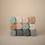 Mushie Dice Press Toy | Cambridge Blue & Shifting Sand